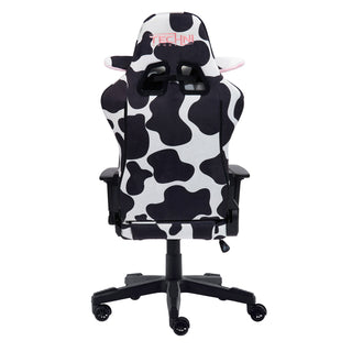 Backview of the cow gaming chair in black and white with the Techni Sport logo in pink on the top headrest. The cow headrest pillow has ears that peakthrough from the back. This cow chair is the the best gaming chair for cute gaming setups. 