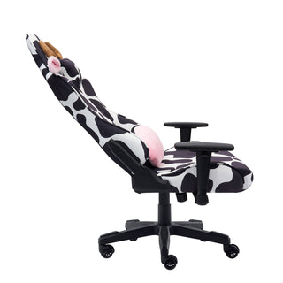 The cow gaming chair in the original black and white cow print is shown in a full 150 degree recline against a white background. The original cow gaming chairs has black hardware such as 2d armrests, base, wheels and casters. 