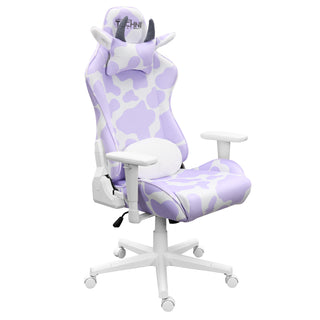 A girl gaming chair for any cute gaming setupThe lavender cow gaming chair by techni sport shown against a white background at an angle. This cute gaming chair has a  reversible lumbar pillow with lavender and white print on one side and fluffy white material on the front The cow gaming chair also features a white base, wheels and hardware. The original cow gaming chair also has a headrest with grey brown horns and cute ears with a fluffy white lining The materials used are velvet for the ultimate softness.